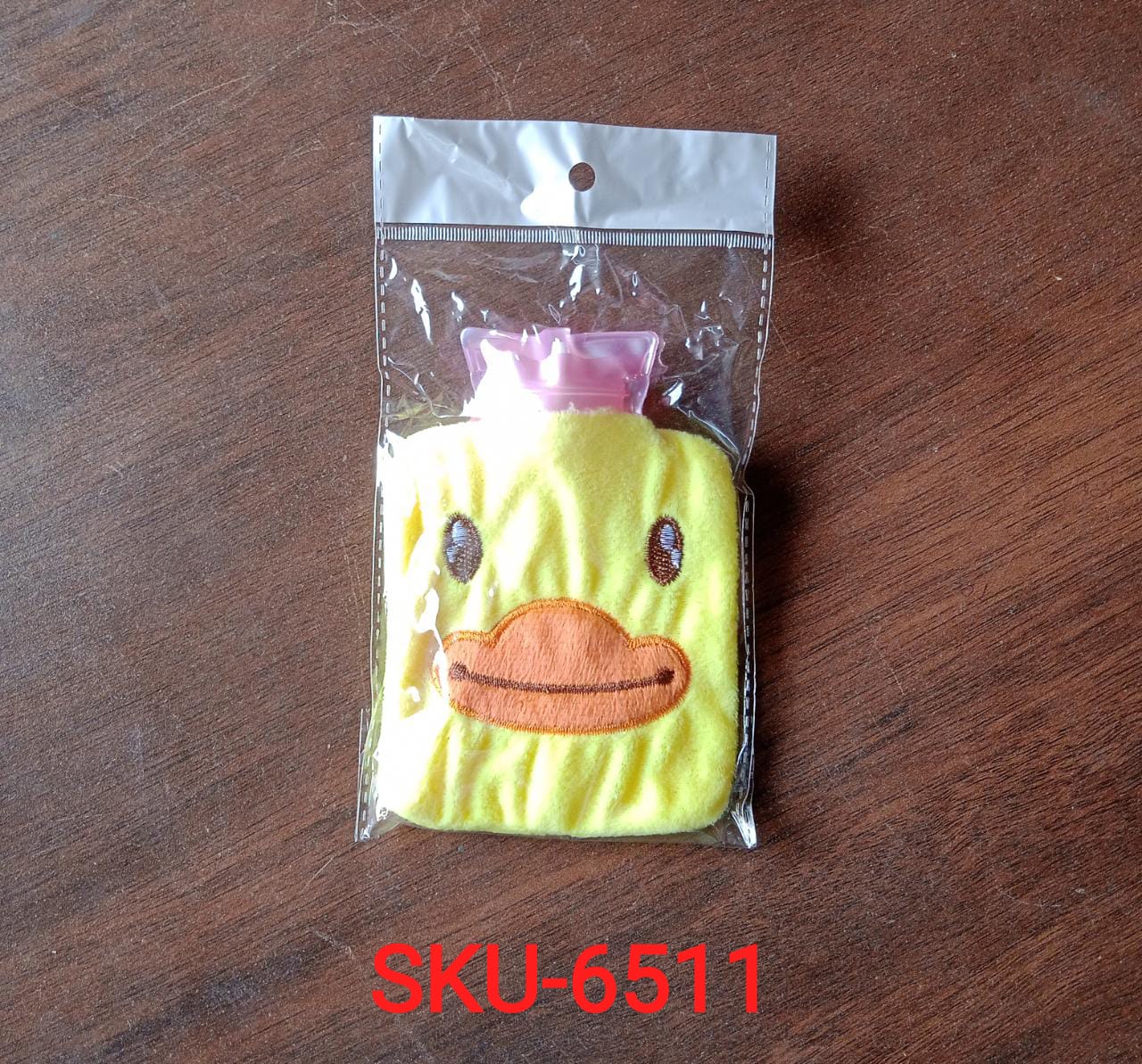 Yellow duck shaped hot water bag for menstrual cramps, neck and shoulder pain Yellow duck shaped hot water bag for menstrual cramps, neck and shoulder pain